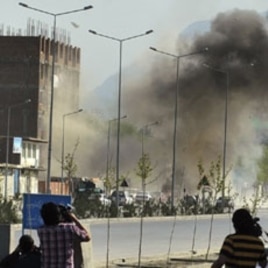 Smoke rises from the site of an attack near the Afghan parliament in Kabul, April 15, 2012.