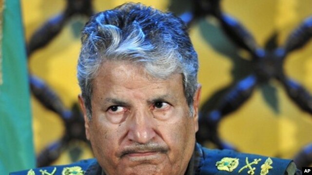 Head of the rebel forces, Abdel Fattah Younes attends a news conference in Benghazi, April 6, 2011
