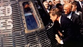 Astronaut John Glenn, right, shows his Friendship 7 space capsule to President John F. Kennedy at Cape Canaveral, Florida, in 1962