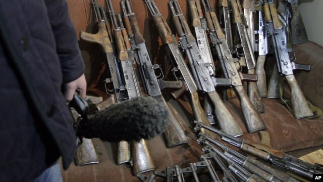 Arms, confiscated from the Garda World private security company, are shown to media in Kabul, Afghanistan, January 5, 2012.
