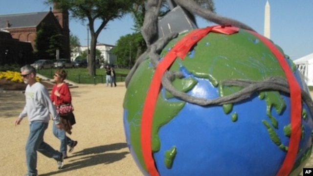 Globes showing environmental challenges are lining the National Mall for Earth Day activities.