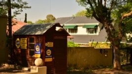 A security hut on a street in Parkhurst, Johannesburg, South Africa, October 2012. Many neighborhoods have a security guard posted on their street at all times. (P. Cox/VOA)
