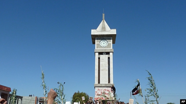 Demonstrators protesting against Syria's President Bashar al-Assad gather in Hula, near Homs in this undated handout released November 4, 2011.