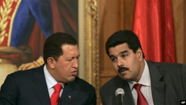 Venezuelan President Hugo Chavez, left, with his then Foreign Minister and current Vice President Nicolas Maduro, Miraflores Palace, Caracas (undated file photo).