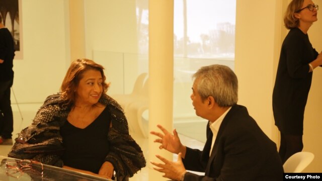 Zaha Hadid talks with Youk Chhang, director of DC-Cam, at the launched design for the Sleuk Rith Institute at her gallery in London, England, on Thursday 9th October, 2014. (Photo by Nhean Socheat/The Sleuk Rith Institute/DC-Cam)