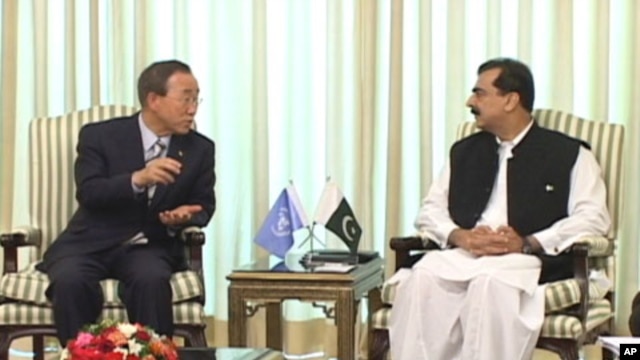 U.N. Secretary-General Ban Ki-moon, left, talks with Pakistani Prime Minister Yousuf Raza Gilani at prime minister's house in Islamabad, Pakistan, Sunday, Aug. 15, 2010.