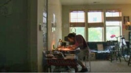 Artist Carl Tucker at work in an apartment specifically tailored for artists in Hyattsville, Maryland.