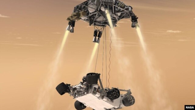  This artist’s concept shows the sky crane maneuver during the descent of NASA’s Curiosity rover to the Martian surface. (NASA/JPL-Caltech)