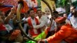 Supporters of India’s ruling Bharatiya Janata Party (BJP) celebrate as early results indicated the party leading in the Maharashtra state Assembly elections in Mumbai, India, Oct. 19, 2014.  
