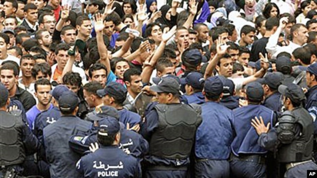 University students face police officers as they demonstrate in Algiers. Students were protesting for increased freedom, April, 11, 2011