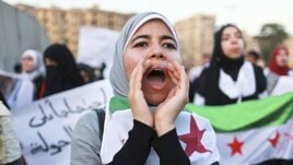 Women take part in a demonstration against Syria's President Bashar al-Assad. (file)