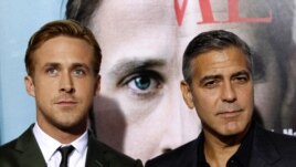 Director, writer, and cast member George Clooney, and cast member Ryan Gosling at the premiere of 