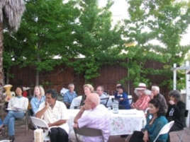 Guests gather for a meal at the home of American Muslim Voice founder Samina Sundas.