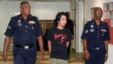 Activist Adam Adli is escorted by police at a courthouse in Kuala Lumpur, May 23, 2013. 