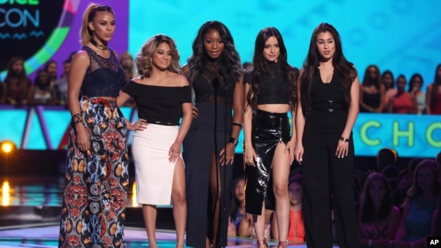 FILE - Dinah Jane Hansen, from left, Ally Brooke, Normani Kordei, Camila Cabello and Lauren Jauregui, of Fifth Harmony, present the Choice Style Icon award at the Teen Choice Awards at the Galen Center in Los Angeles, Aug. 16, 2015.