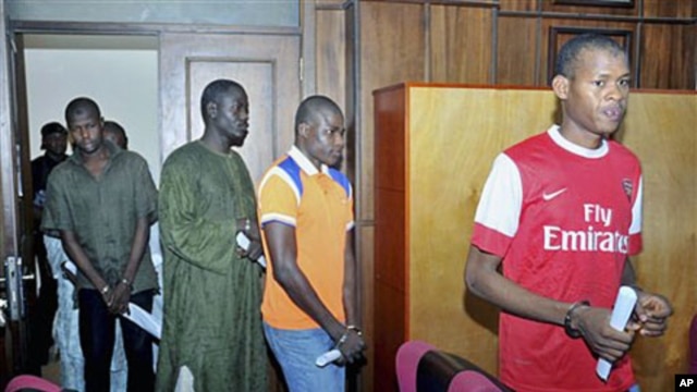 Suspected members of Boko Haram sect enter the federal High court  where they are accused of plotting bombings that killed 25 people, Abuja, September 23, 2011.