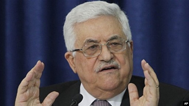 Palestinian President Mahmoud Abbas gestures as he speaks during a press conference with members of the Israeli Peace Initiative in Ramallah, April 28, 2011