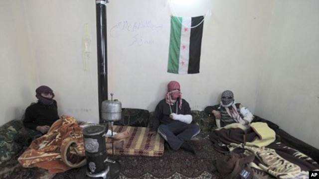 Injured members of the Free Syrian Army take refuge at a makeshift hospital in Idlib province, March 1, 2012.