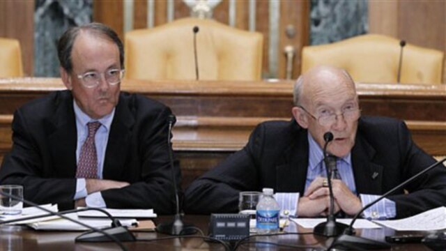Democrat Erskine Bowles, left, and Republican Alan Simpson meet with reporters in Washington to present their plan for reducing the government's budget deficit