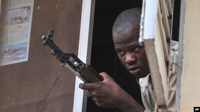A Malian soldier looks on as junta leader captain Amadou Sanogo speaks at the Kati military camp near Bamako, April 3, 2012.