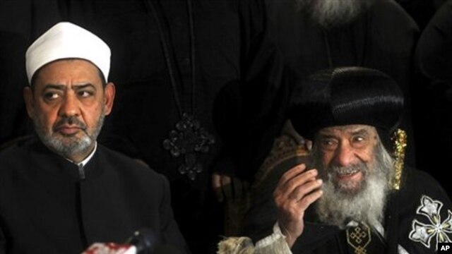 Ahmed el-Tayeb the grand sheik of Cairo's Al-Azhar, the pre-eminent theological institute of Sunni Islam, left, and Pope Shenouda III, the head of the Coptic church, talk to the media in Cairo, Egypt, Sunday Jan. 2 , 2011