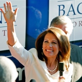 Republican presidential candidate Rep. Michele Bachmann, R-Minn., waves to supporters outside her campaign bus after being named the winner of the Iowa Republican Party's Straw Poll, Saturday, Aug. 13, 2011, in Ames, Iowa.