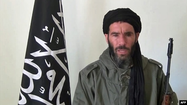 FILE - Undated photo obtained by ANI Mauritanian news agency reportedly shows former Al-Qaida in the Islamic Maghreb (AQIM) emir Mokhtar Belmokhtar speaking at an undisclosed location.