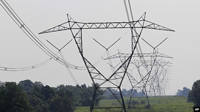 Electric lines extend over the hills of Owen County, near Owenton, Kentucky, July 22, 2011.