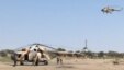 FILE - Mi-8 attack helicopters are seen in Fotokol, Cameroon, after an operation in nearby Gambaru, Nigeria. Chadian aircraft struck Boko Haram positions in the Nigerian border town for a second straight day, Feb. 1, 2015.