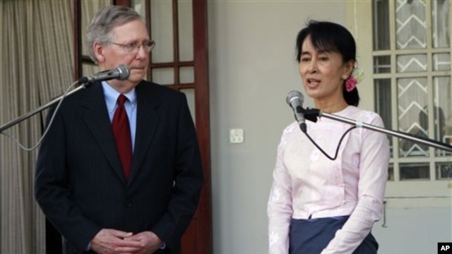 US Senator Mitch McConnell, left, listens to Burmese pro-democracy leader Aung San Suu Kyi in Rangoon, Burma Jan. 16, 2012.