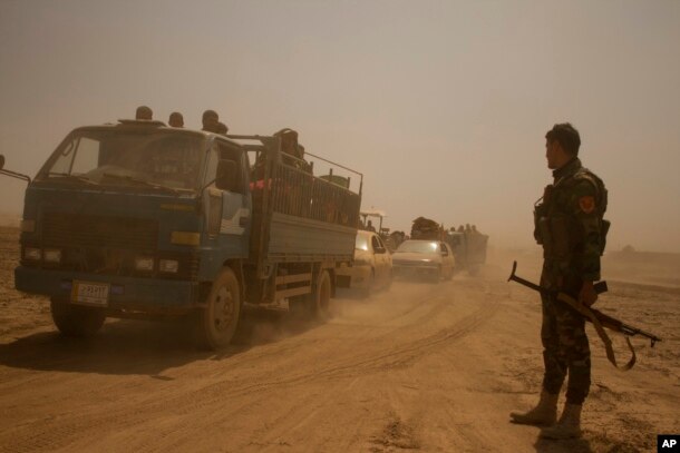 Hundreds of civilians flee villages outside Mosul a day after Iraqi Kurdish forces launched an operation east of Islamic State-held Mosul, Aug. 15, 2016.