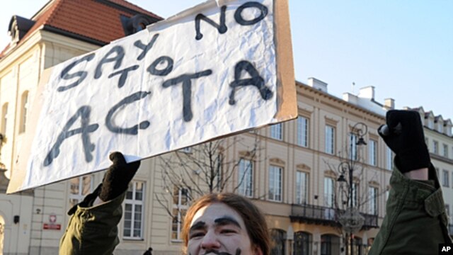 A protester shouts slogans during a demonstration against the Anti-Counterfeiting Trade Agreement (ACTA), in front of the Presidential Palace in Warsaw, Poland, February 11, 2012.