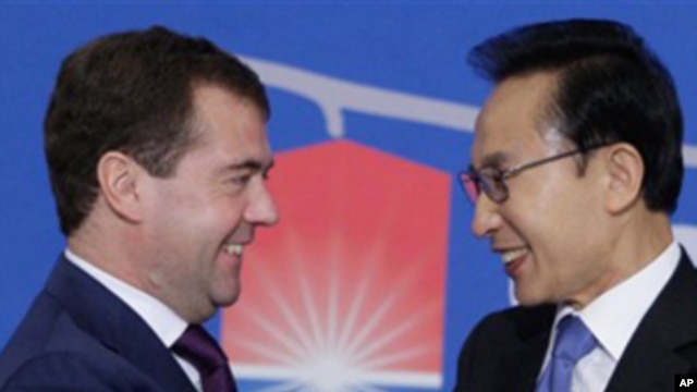Russian President Dmitry Medvedev, left, and South Korean President Lee Myung-bak shake hands before their press conference  in Seoul, South Korea. Medevev is on an official visit to South Korea. Twenty world leaders, including Medvedev, will come togethe