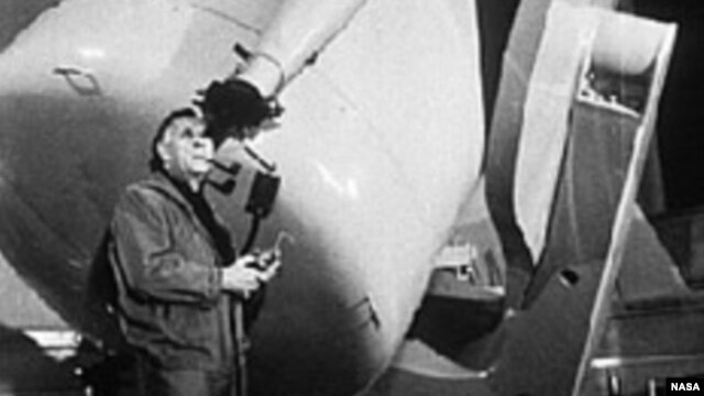 Edwin Hubble looks through a guidescope of the 1.2 meter telescope at the Palomar Observatory in California.