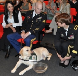 Sgt. Campbell with Pax, wife Domenica (left) and Brig. Gen. Loree Sutton (right)