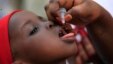 FILE - A health official administers a polio vaccine to a child in Kawo Kano, Nigeria, April. 13, 2014.