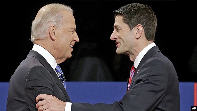 Vice President Joe Biden (l) and Republican vice presidential nominee Rep. Paul Ryan of Wisconsin shake hands before the vice presidential debate at Centre College,  in Danville, Kentucky, Oct. 11, 2012.