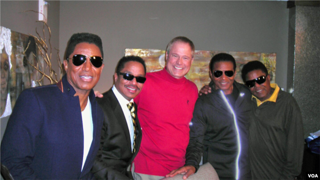 The Jacksons meet up with Border Crossings host Larry London for an interview on his VOA radio program.