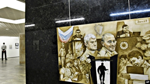 A painting of fallen Russian oligarchs Mikhail Khodorkovsky and Platon Lebedev is displayed at the Central House of Artists in Moscow (file photo)