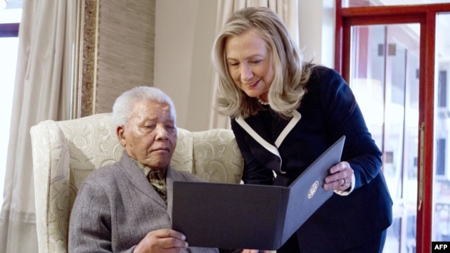 US Secretary of State Hillary Rodham Clinton meets with Nelson Mandela, 94, former president of South Africa, at his home in Qunu, South Africa, on August 6, 2012. 