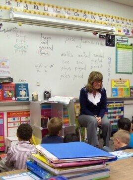 Teacher Sonja Pellerin with first and second-grade students at Hinkley School, which will soon close. (VOA/C. Richard)