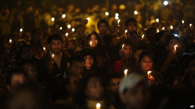 Indians hold candles as they mourn the death of a gang rape victim in New Delhi, India, Saturday, Dec. 29, 2012. 