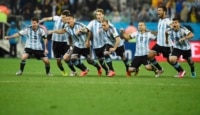 Argentina's national soccer players celebrate after their teammate Maxi Rodriguez scored the decisive goal during a penalty shoot-out against the Netherlands at their 2014 World Cup semi-finals at the Corinthians arena in Sao Paulo July 9, 2014. Pictured are (L-R) Argentina's Lionel Messi, Pablo Zabaleta , Martin Demichelis , Marcos Rojo , Lucas Biglia , Rodrigo Palacio , Javier Mascherano, Ezequiel Garay and Sergio Aguero. REUTERS/Dylan Martinez