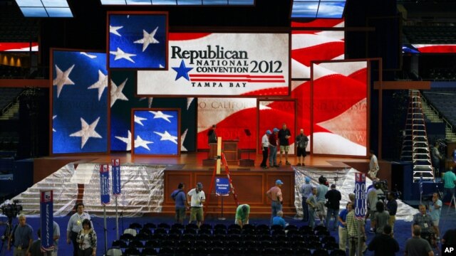 Workers prepare the stage for the Republican National Convention inside the Tampa Bay Times Forum, in Tampa, Florida, August 25, 2012.