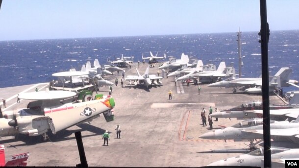 Radar Jet (left) and other jets are pictured on the deck of the USS Ronald Reagan. (Neou Vannarin/VOA Khmer)