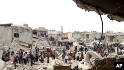 People searching the rubble after a missile attack by Syrian government forces in Aleppo, Syria. (Feb. 26, 2013)