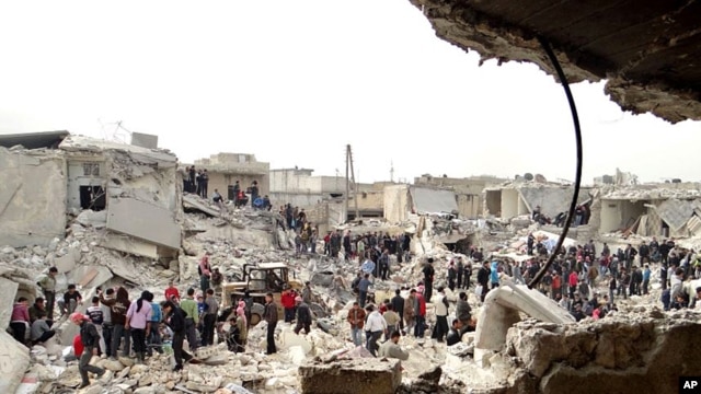 People searching the rubble after a missile attack by Syrian government forces in Aleppo, Syria. (Feb. 26, 2013)