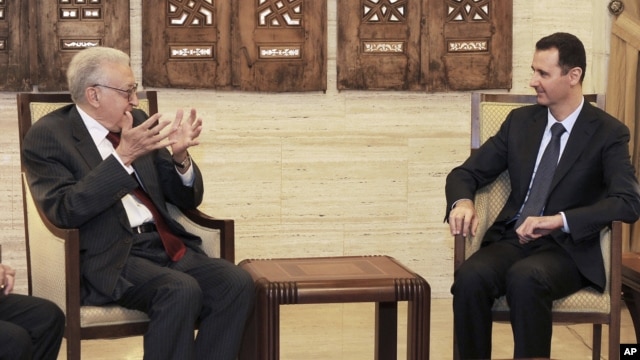 In this photo released by the Syrian official news agency SANA, Syrian President Bashar Assad, right, meets with the U.N.-Arab League envoy Lakhdar Brahimi, in Damascus, September 15, 2012. 