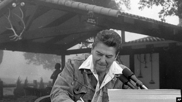 President Ronald Reagan signs a major tax cut bill at his ranch near Santa Barbara, California
