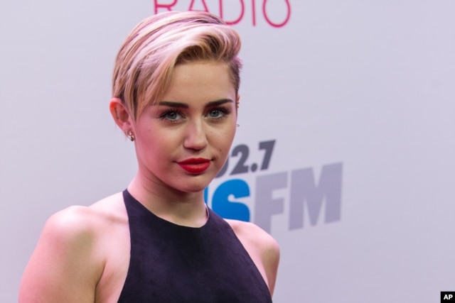 Miley Cyrus arrives at the KIIS 102.7 Jingle Ball held at the Staples Center in Los Angeles, California, Dec., 6, 2013.